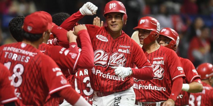 Baseball Players in Red Uniforms Celebrate, High-fiving and Embracing on the Field. - Hola Mty